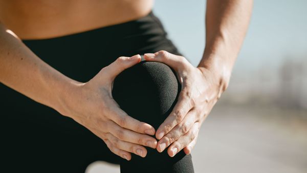 a woman with knee pain