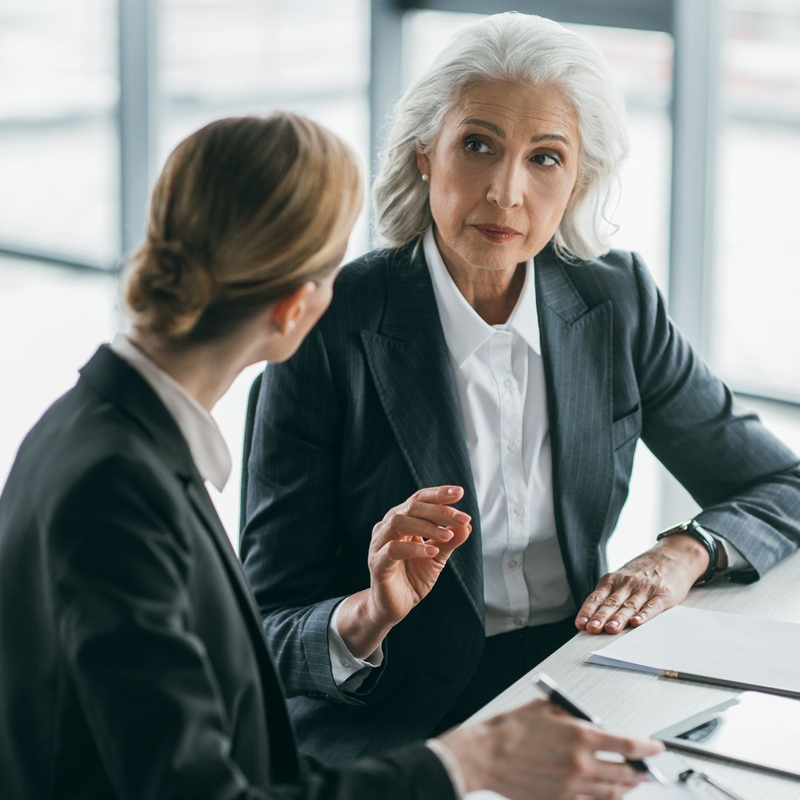 2 business women in a meeting