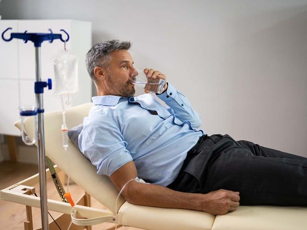 man receiving IV therapy