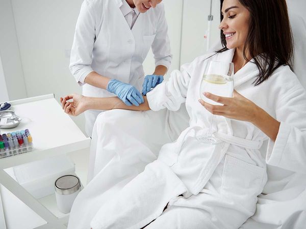 woman receiving IV therapy