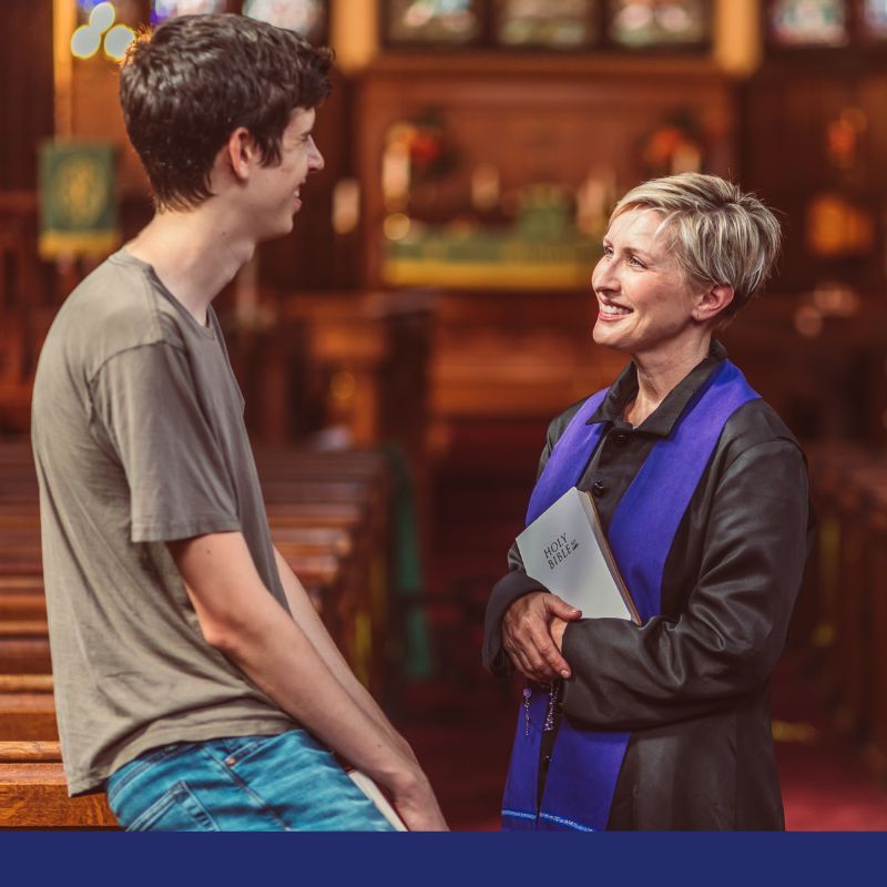 preacher with church member