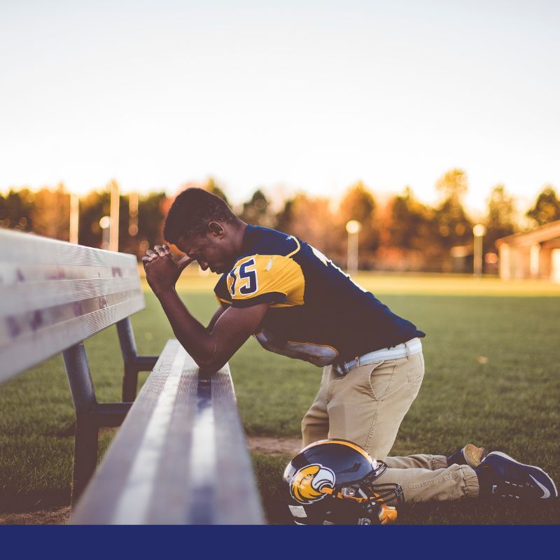 football player praying
