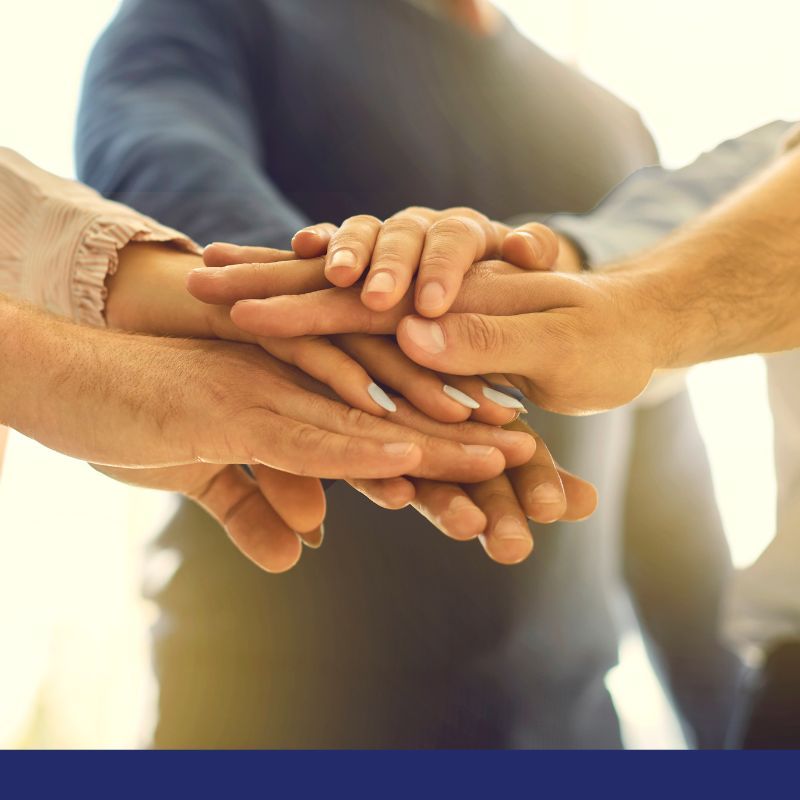 Teammates with Hands Together