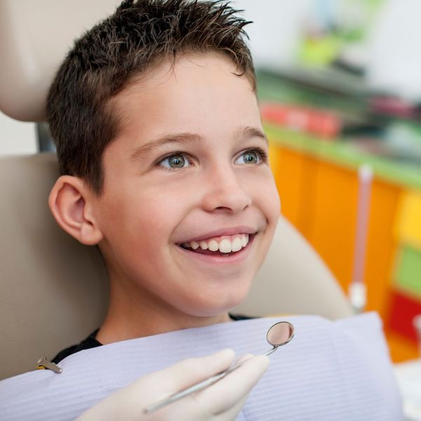 smiling boy at at the dentist office