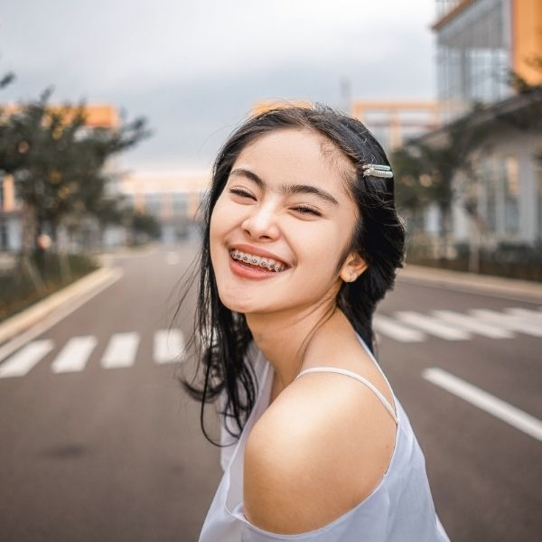 A woman wearing braces.