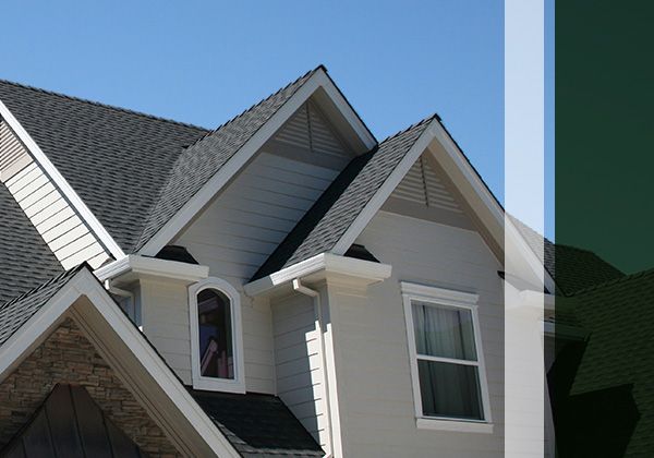 house with shingle roof, steep gables