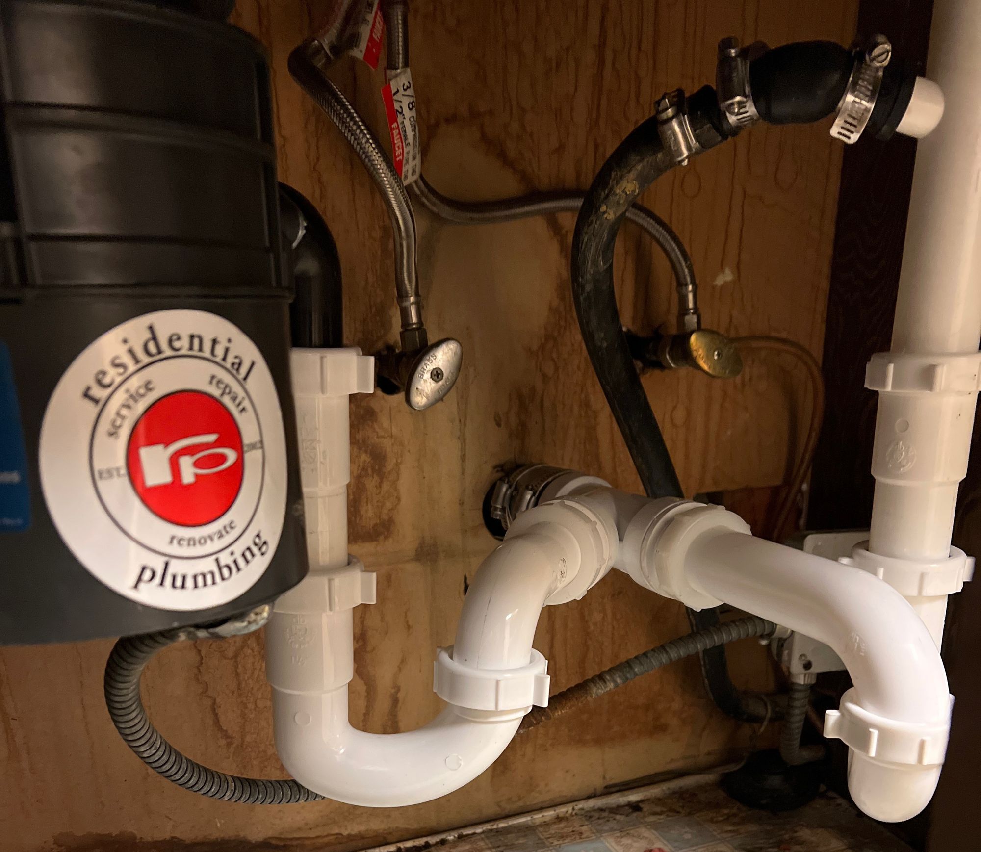 Re-piping under sink with garbage disposal.jpg