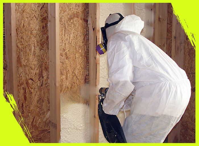 technician spraying foam insulation