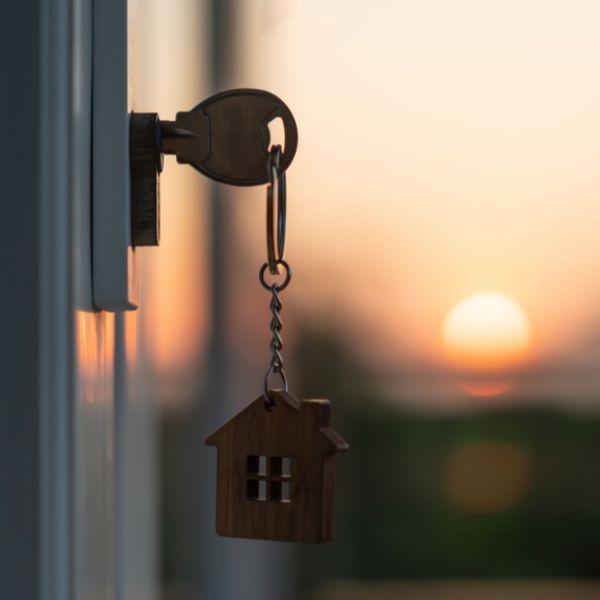 key in door with sunset in background