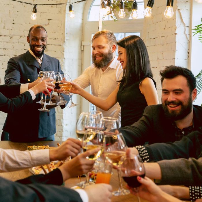 Groups of people cheers wine glasses