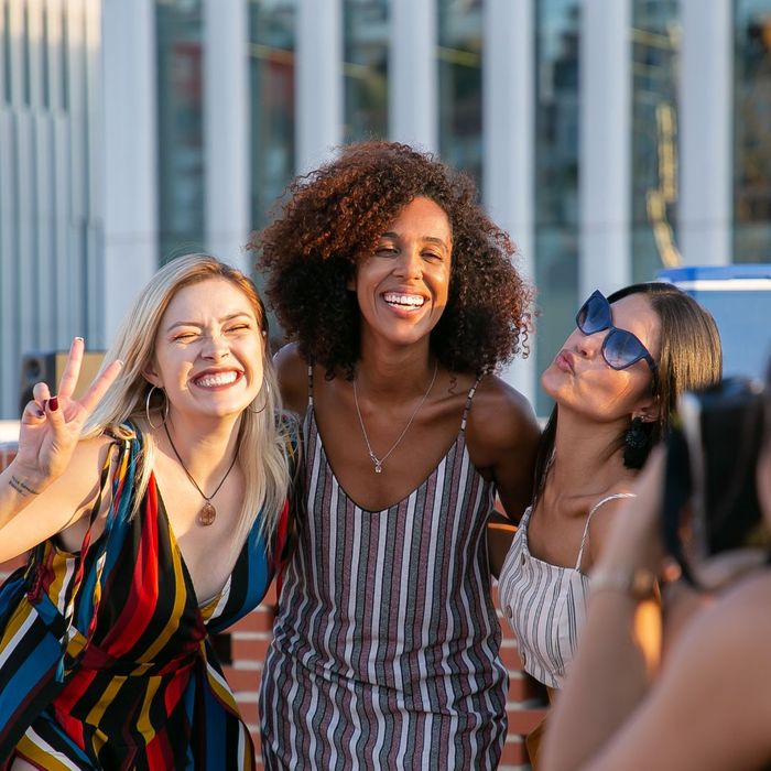 group of women having photo taken at corporate party group of women having photo taken at corporate party