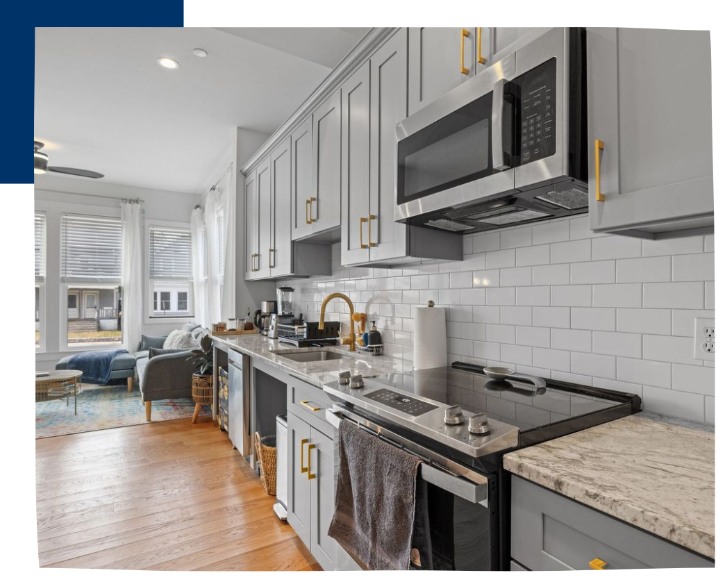 kitchen with gray cabinets, microwave and oven