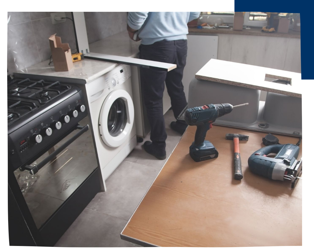 appliance repair tech working on appliances