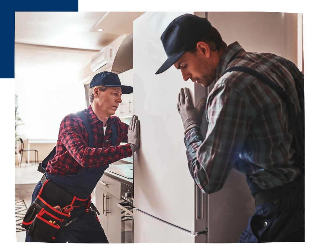 2 men pushing fridge