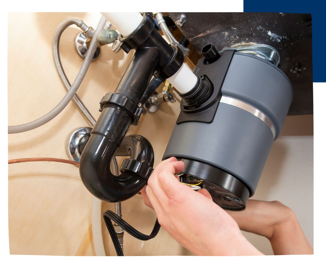 black and gray garbage disposal under sink