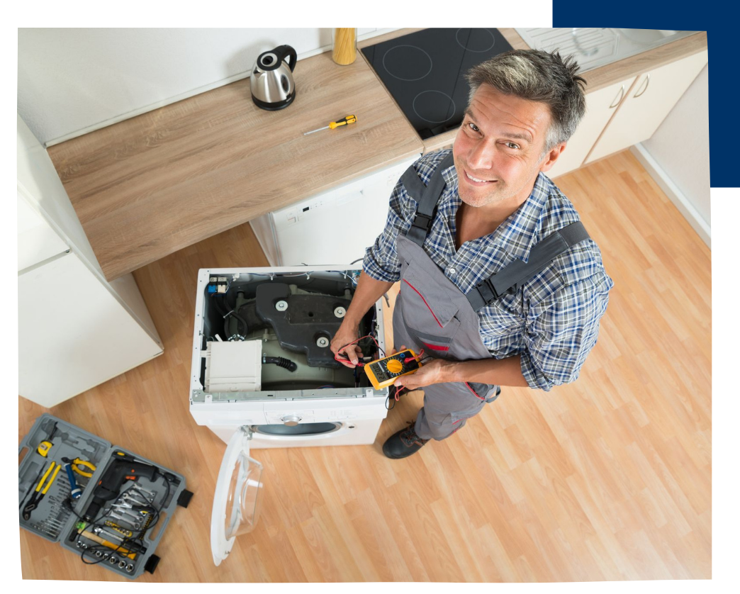 man looking up as fixing washing machine