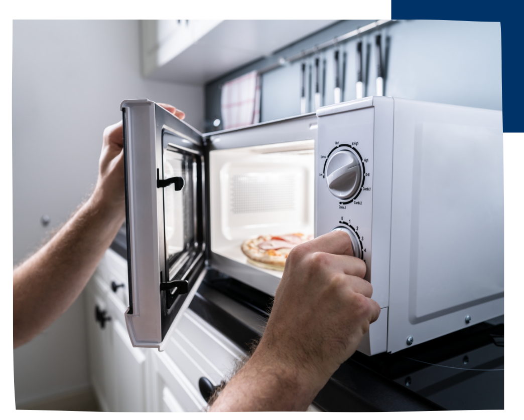 person using microwave
