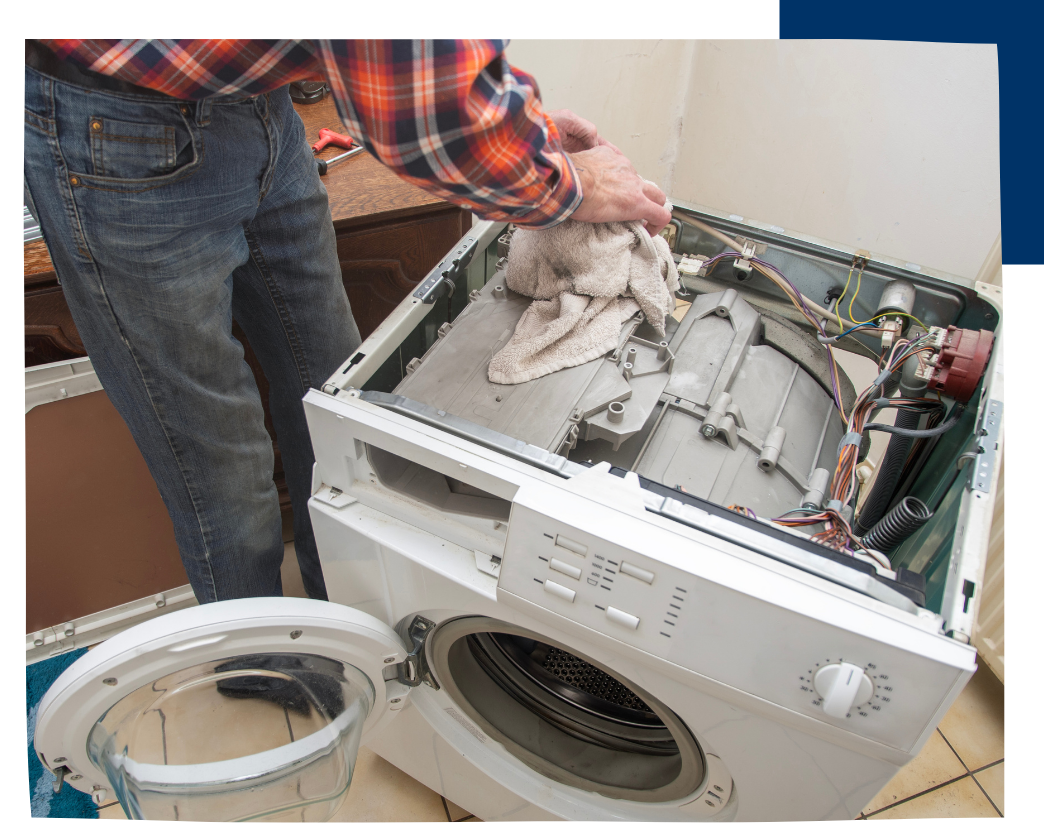 man repairing top of dryer