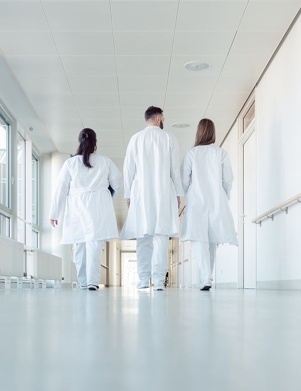 Doctors walking through a hospital corridor
