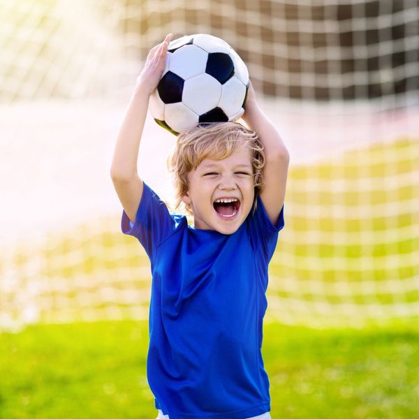 confident and excited young soccer player