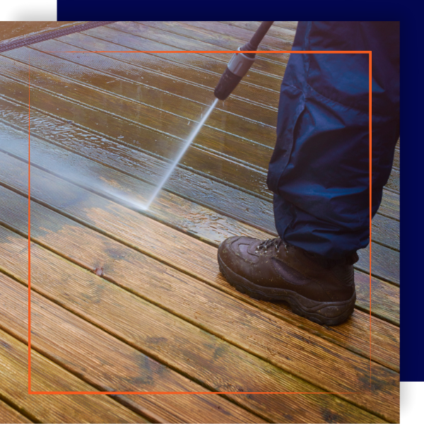 Power washing wooden deck.
