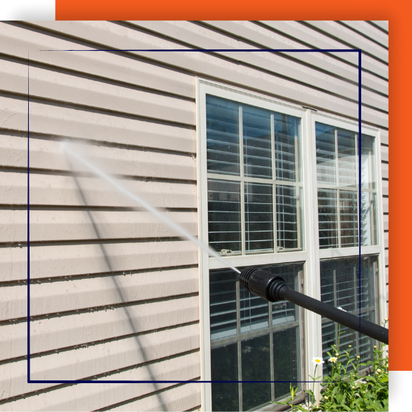 Power washing home siding.