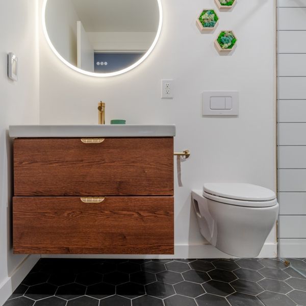 image of a bathroom with a floating toilet and vanity