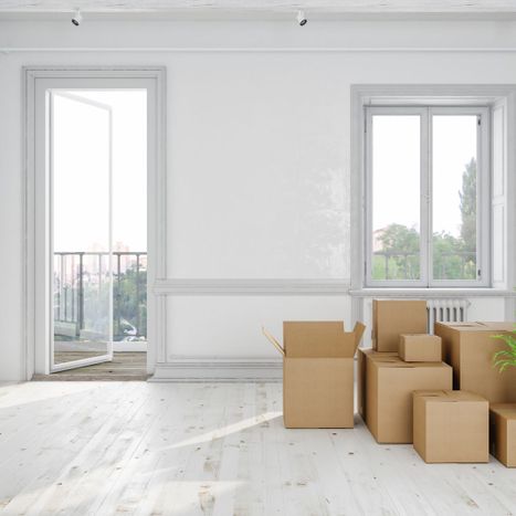 boxes stacked in an empty home