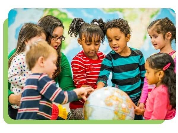 kids looking at a globe