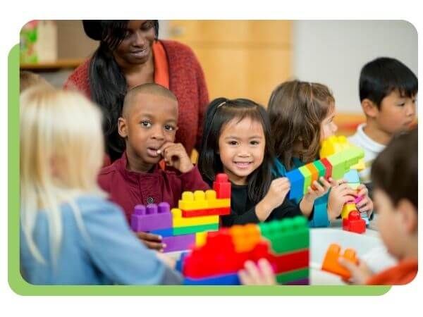 children playing with blocks in preschool