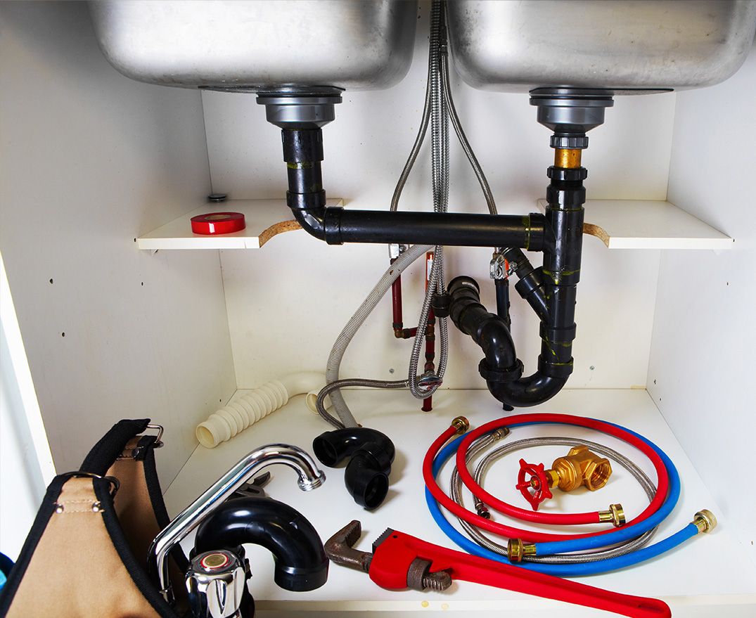 pipe connections under a sink