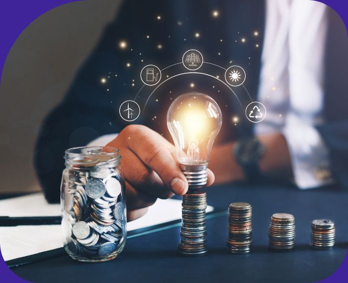 increasing stacks of coins with someone holding an illuminated lightbulb with energy graphics around it increasing stacks of coins with someone holding an illuminated lightbulb with energy graphics around it