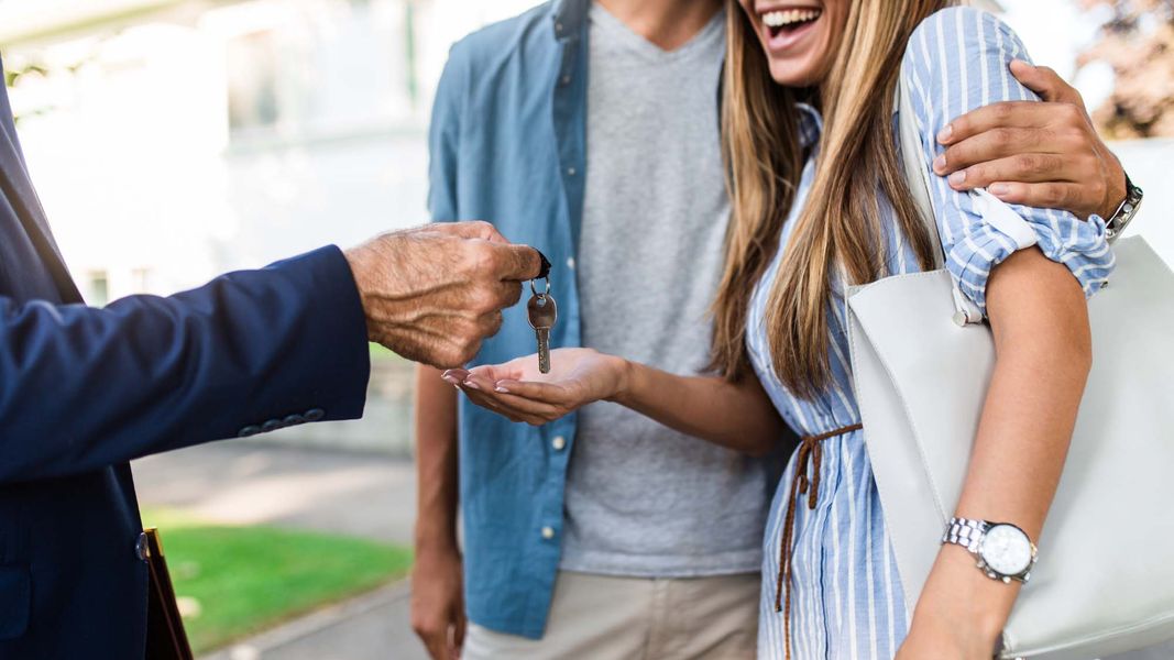 couple with new house key