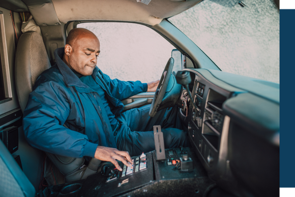 truck driver in cab of truck