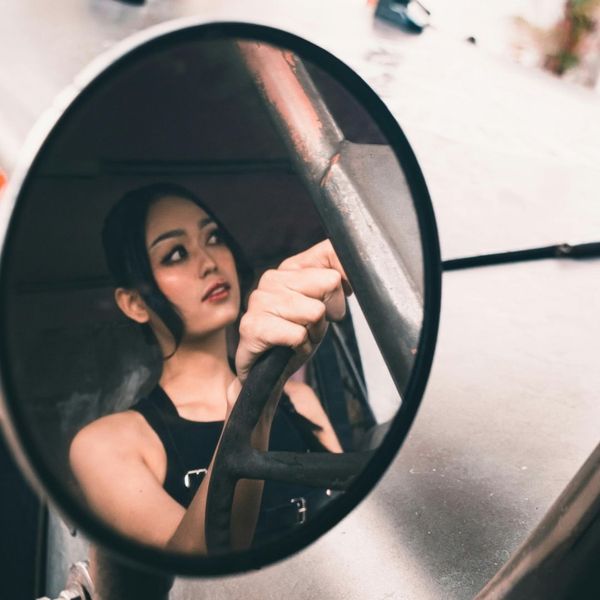 Woman driving a large truck.