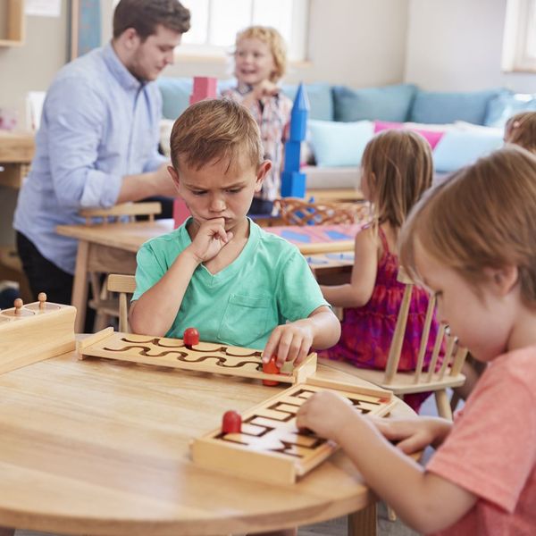 a boy thinking about a puzzle Our Unique Educational Philosophy.jpg