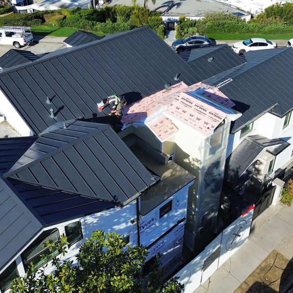 drone view of new standing seam metal roof drone view of new standing seam metal roof
