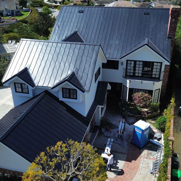 Standing Seam Metal Roof on a white beautiful home