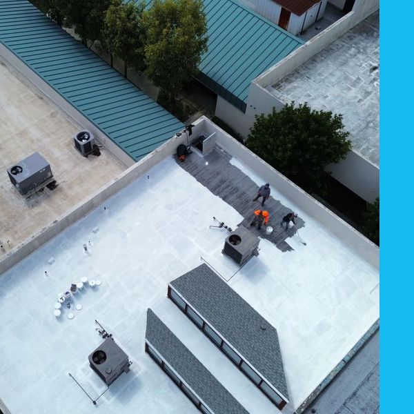 Precision team working on commercial roof