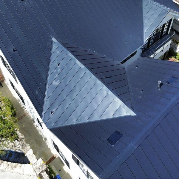 drone view of new standing seam metal roof drone view of new standing seam metal roof