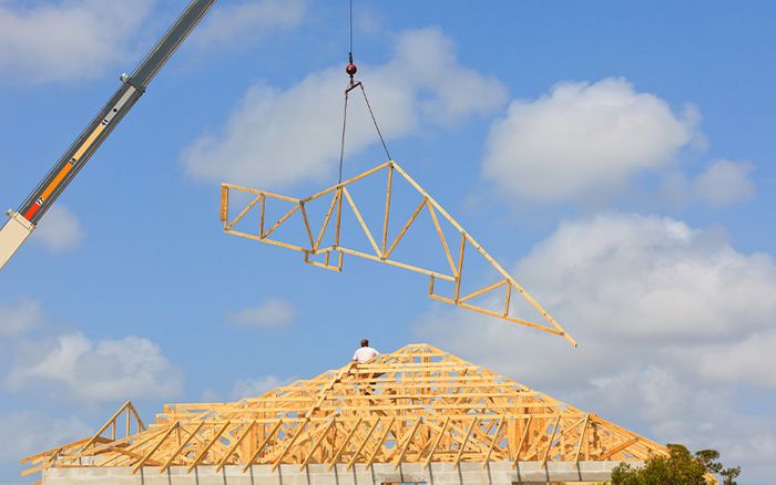 lowering a truss on a home