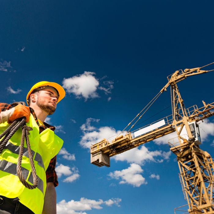Construction worker in front of a blue sky