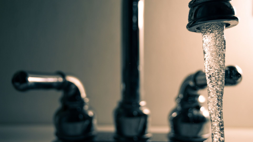 faucet running clean drinking water free of backflow contamination