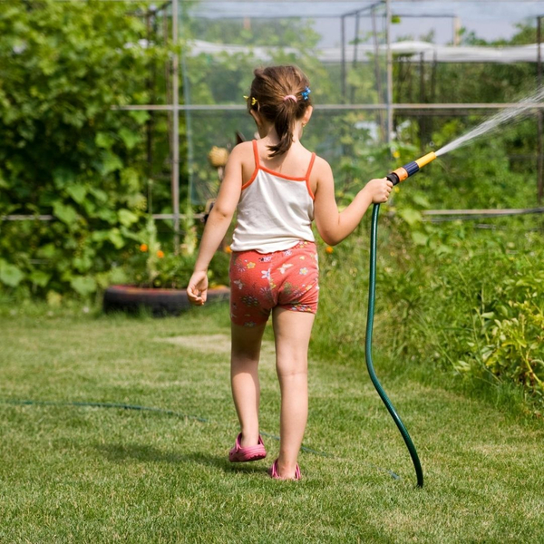 kid watering garden