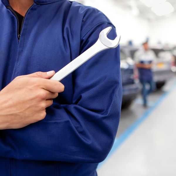 mechanic holding a wrench