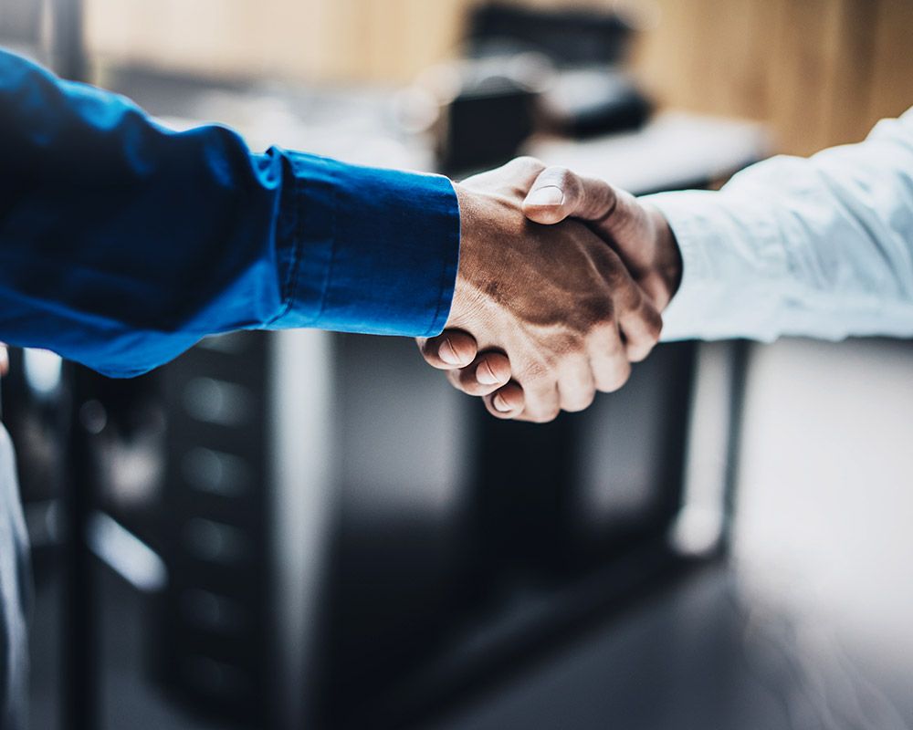 Photo of a hand shake Photo of a hand shake