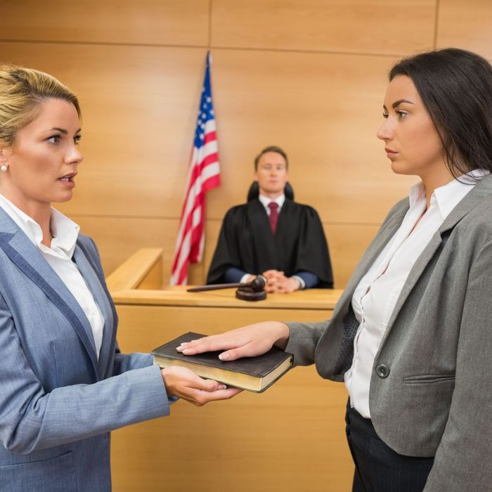 woman being sworn in under oath in court