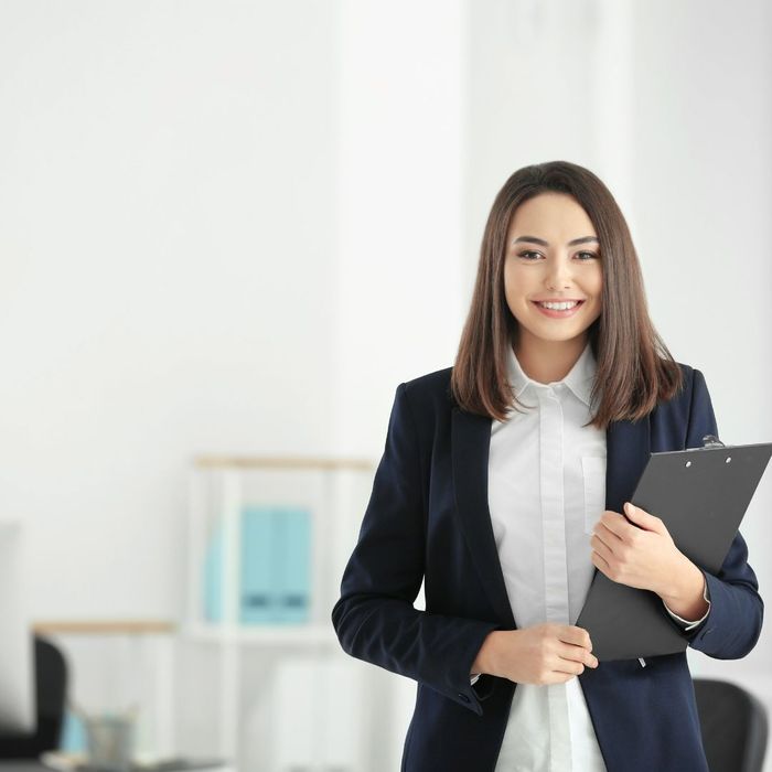 smiling woman with a clipboard