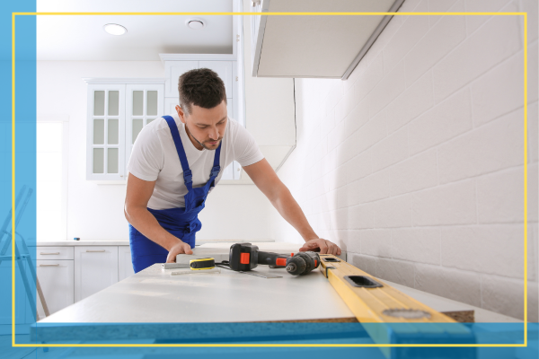 man installing countertops.