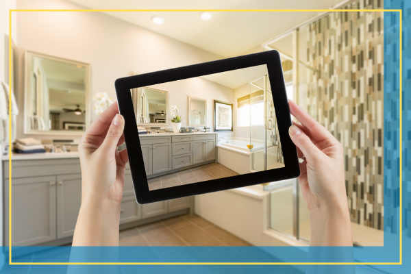 person using a tablet to visualize a bathroom remodel. 